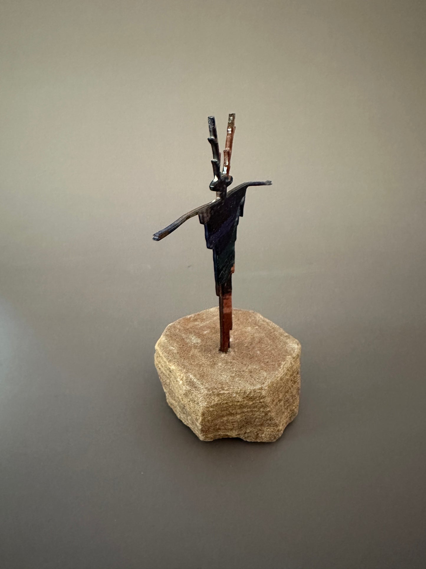 Abstract Metal Figure on Sandstone Base