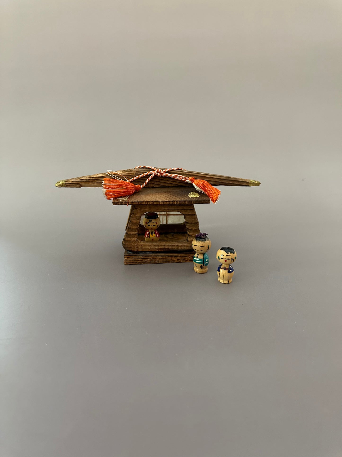 Vintage Wooden Dwelling with Kokeshi Figures