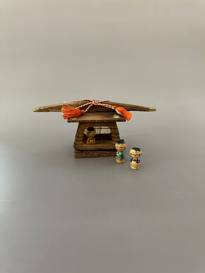 Vintage Wooden Dwelling with Kokeshi Figures