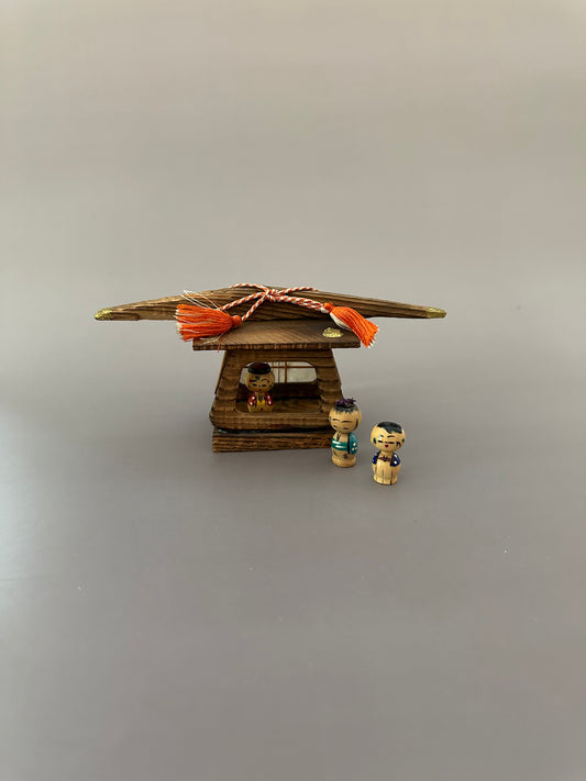 Vintage Wooden Dwelling with Kokeshi Figures